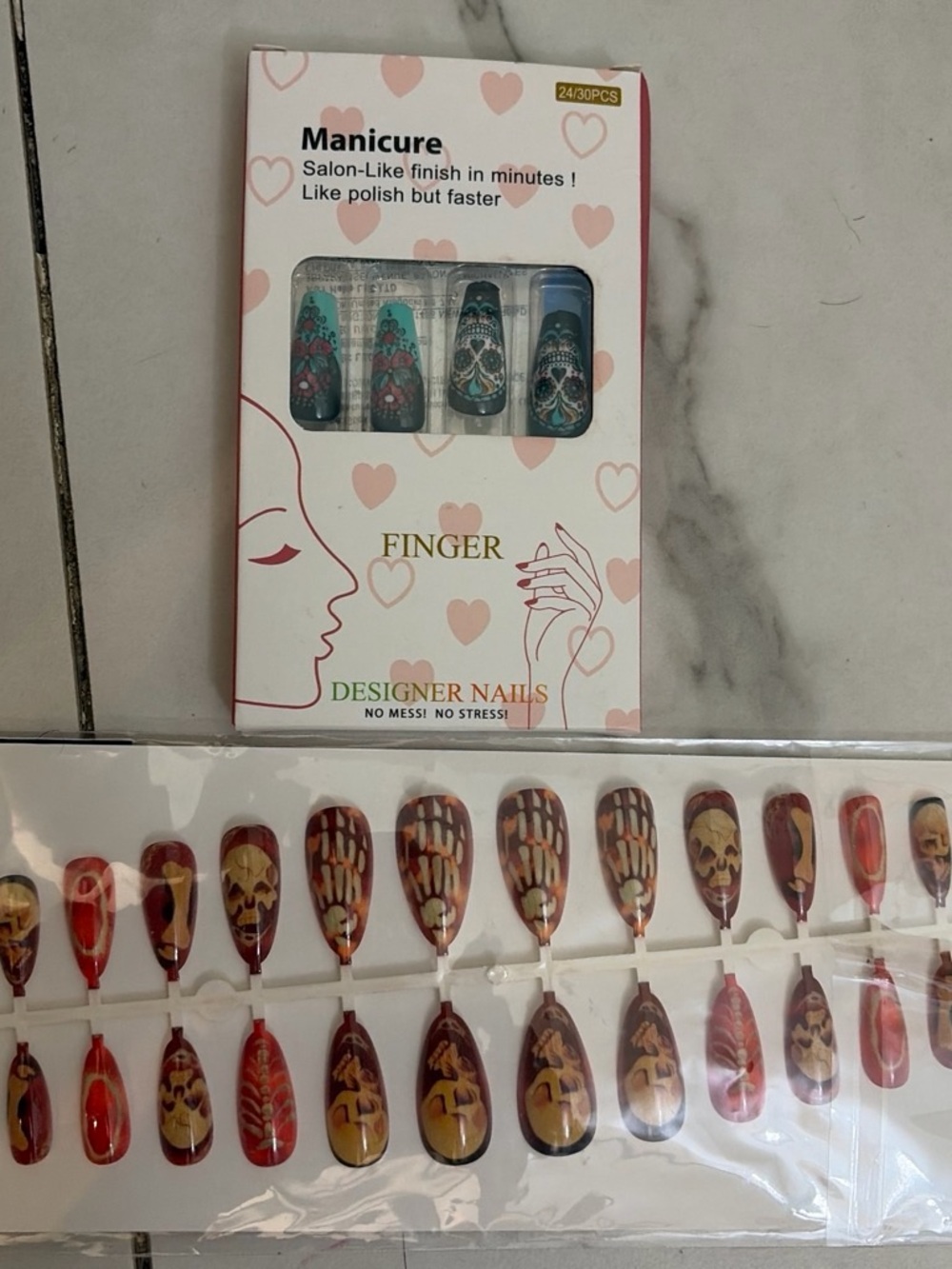 2 sets of press on nails, skulls and dia de los muertos